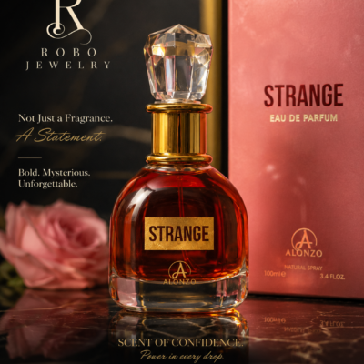 Strange Eau De Parfum by Alonzo 100ml displayed in an elegant luxury glass bottle with a crystal-inspired cap beside its blush pink packaging.